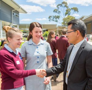 Bishop Vincent Long OFM Conv meets young catechists who share their Catholic faith with students in government primary schools. Photo: Jordan Grantham. 