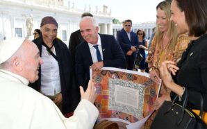Pope Francis is presented with a copy of the Uluru Statement of the Heart in 2022. Image: Vatican Media.