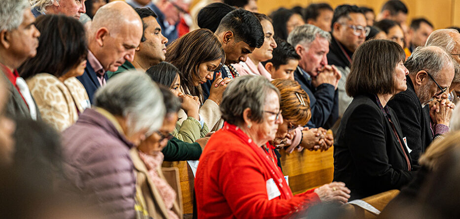 Members of the faithful are seen in prayer at Mass