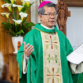 Bishop Vincent Long delivers a homily wearing green vestment