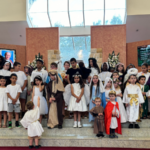 The cutest saints you e’er did see! Families and children buck the Halloween trend