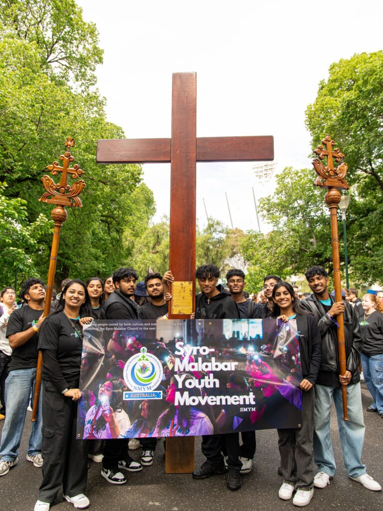 Youth pilgrims carry the World Youth Day Cross through Melbourne's streets. Image: supplied/Catholic Youth Parramatta.